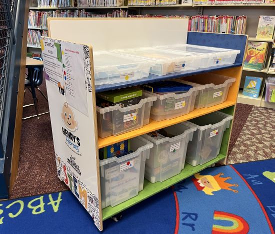 Rolling STEM cart with game in children's area